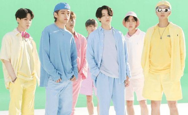 Which companies do not want BTS to be allowed to postpone enlistment?