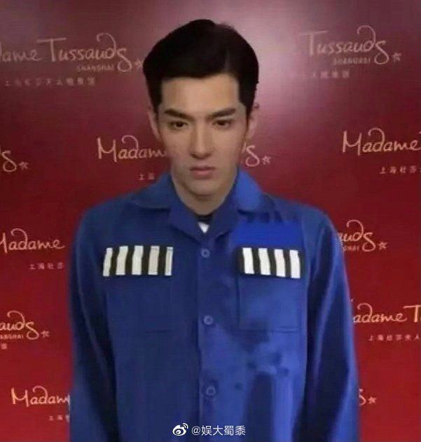 after the shocking scandal wu yifan wax figure in shanghai was immediately changed to wear a prisoners shirt 238209830982