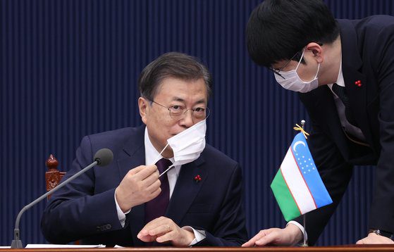 President Moon Jae In and The Blue House's secretary of protocol Tak Hyunmin