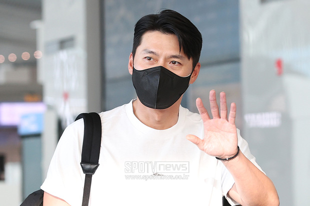 He waved to reporters and fans at the airport 