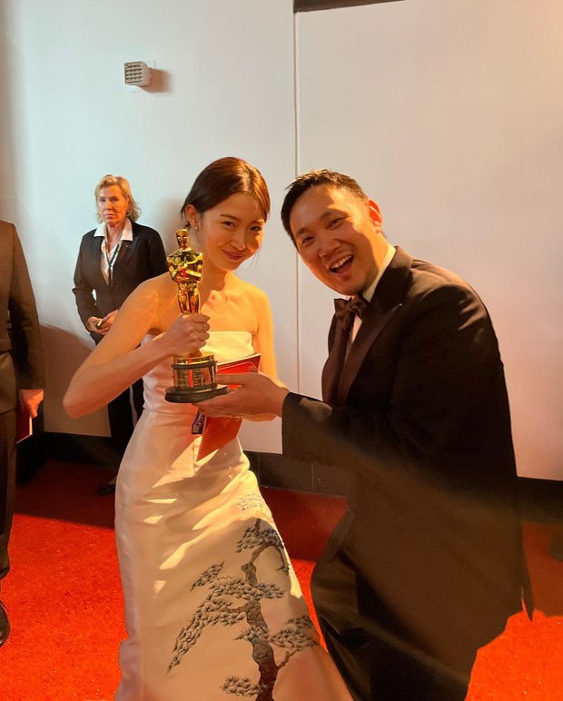 Park Yu Rim and the Oscar trophy for Drive My Car