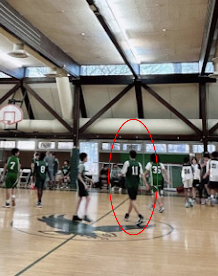 A photo of Kwon Sang Woo’s son from behind in jersey #11