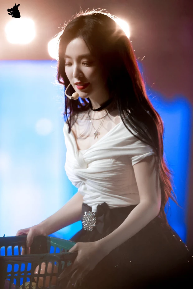 Irene radiates in a graceful look.
