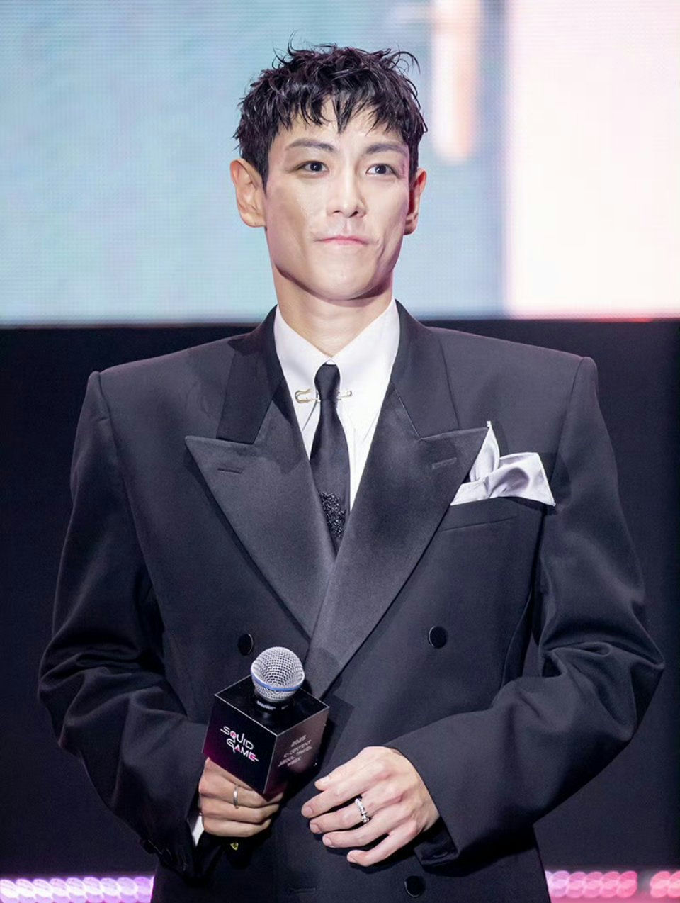 T.O.P Squid Game 3 appearanceMan-Suit-Microphone-Elegant.