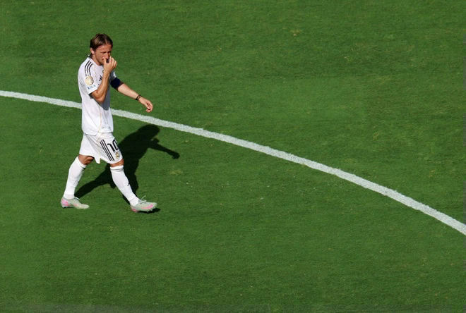 Luka Modric Real Madrid farewellsoccer' 'player' 'grass' 'uniform' 'lines.