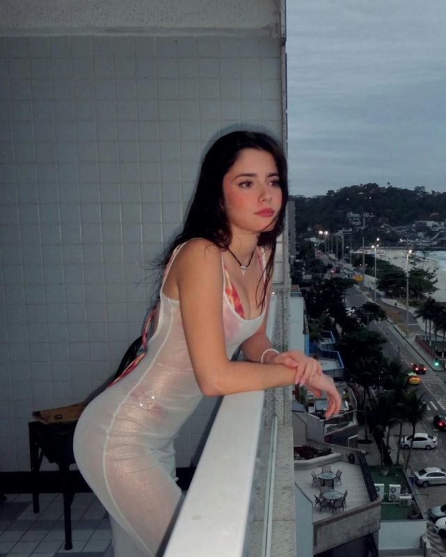 Madalena Aragão Joao Neveswoman' 'balcony' 'city' 'night.