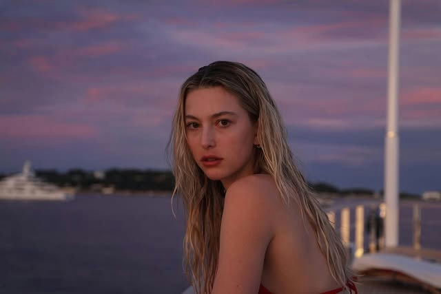 Steve Jobs daughterswoman' 'sunset' 'yacht' 'ocean.