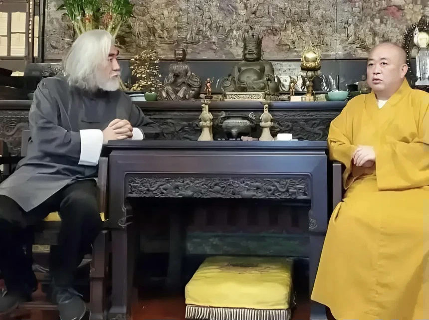 Shi Yongxin Shaolin Temple film industrytwo' 'eople' 'monk' 'buddha' 'tatues' 'ornate' 'able.