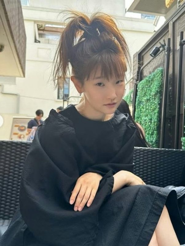 Park So-dam transformationwoman' 'blackdress' 'ponytail' 'sitting.