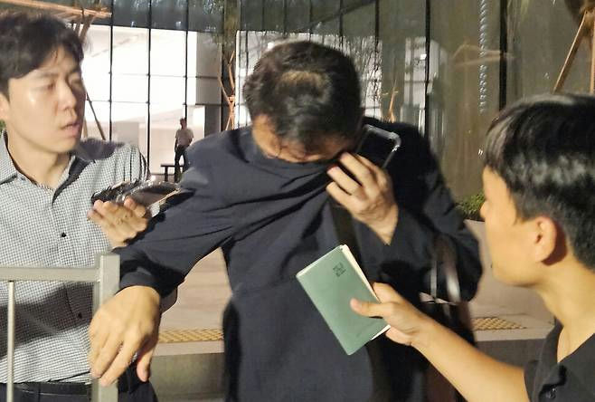 Kim Jin‑woo necklace concealment investigationcrying' 'interview' 'passport' 'reporters.