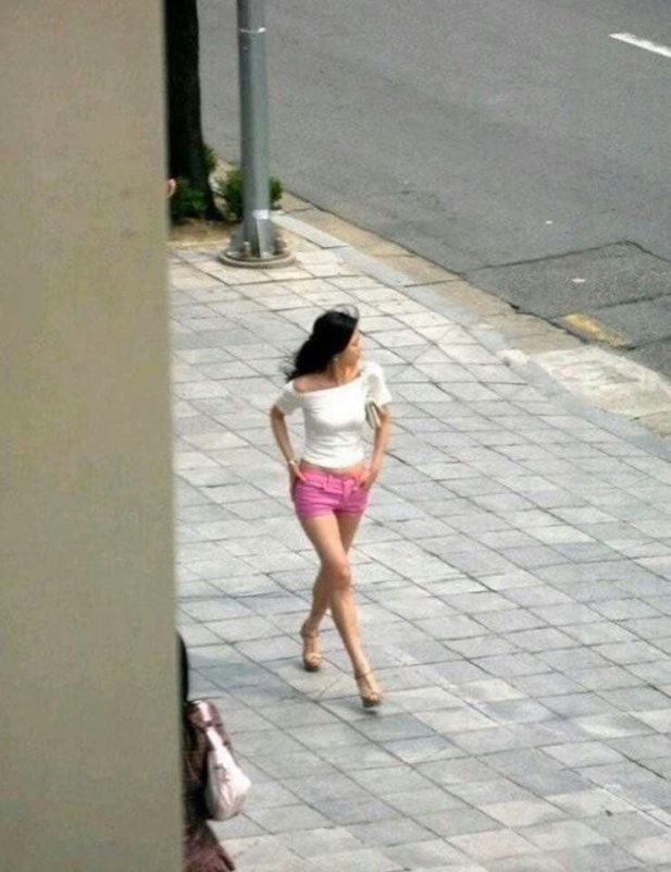 Y2K fashion Jeon Ji Hyun Angelababywoman' 'pinkshorts' 'sidewalk' 'street.
