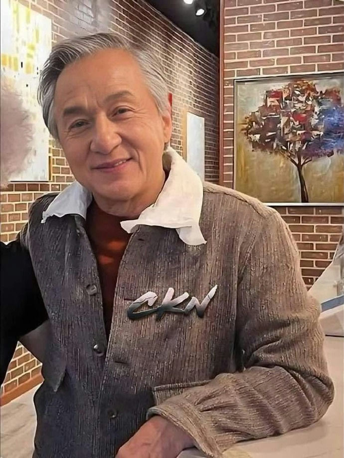 Jackie Chan failed fatherperson' 'grayhair' 'jacket' 'painting' 'brick' '.