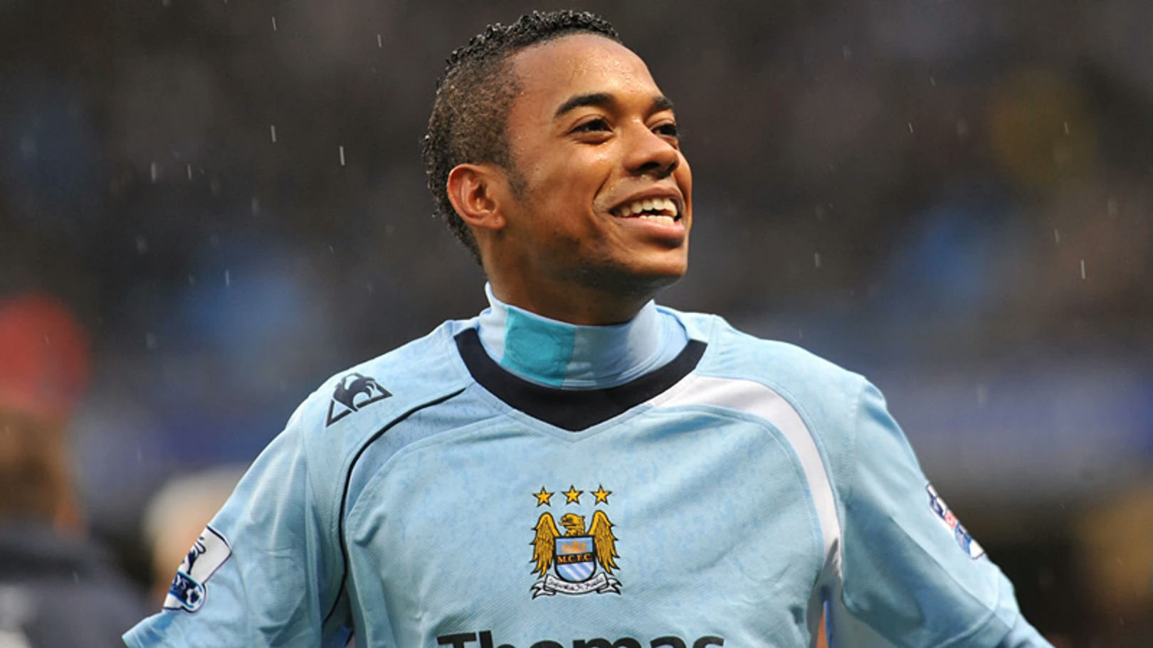 Robinho betting company after prisonone' 'person' 'soccer' 'player' 'smiling' 'uniform' 'celebrating.