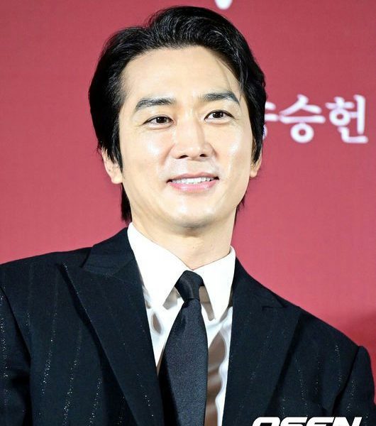 Song Seung-heon breakup reasonperson' 'male' 'suit' 'tie' 'smile.