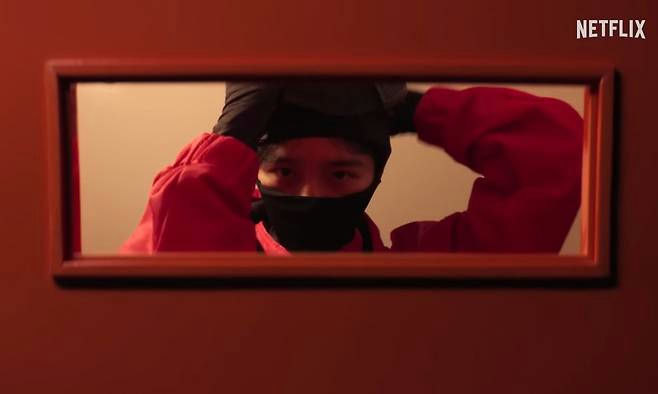 trusted Korean actorsperson' 'mask' 'red' 'gloves' 'door.