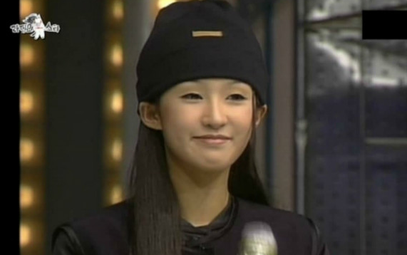 Hong Jin Kyung chaebol marriageperson' 'smiling' 'beanie' 'microphone' 'indoors.