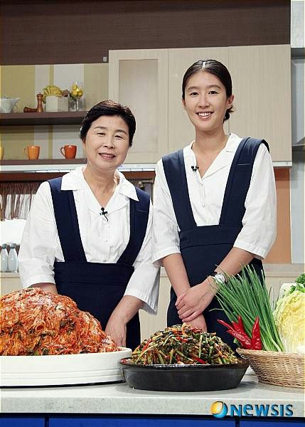Hong Jin Kyung chaebol marriagepeople' 'kimchi' 'aprons' 'smiling' 'studio.