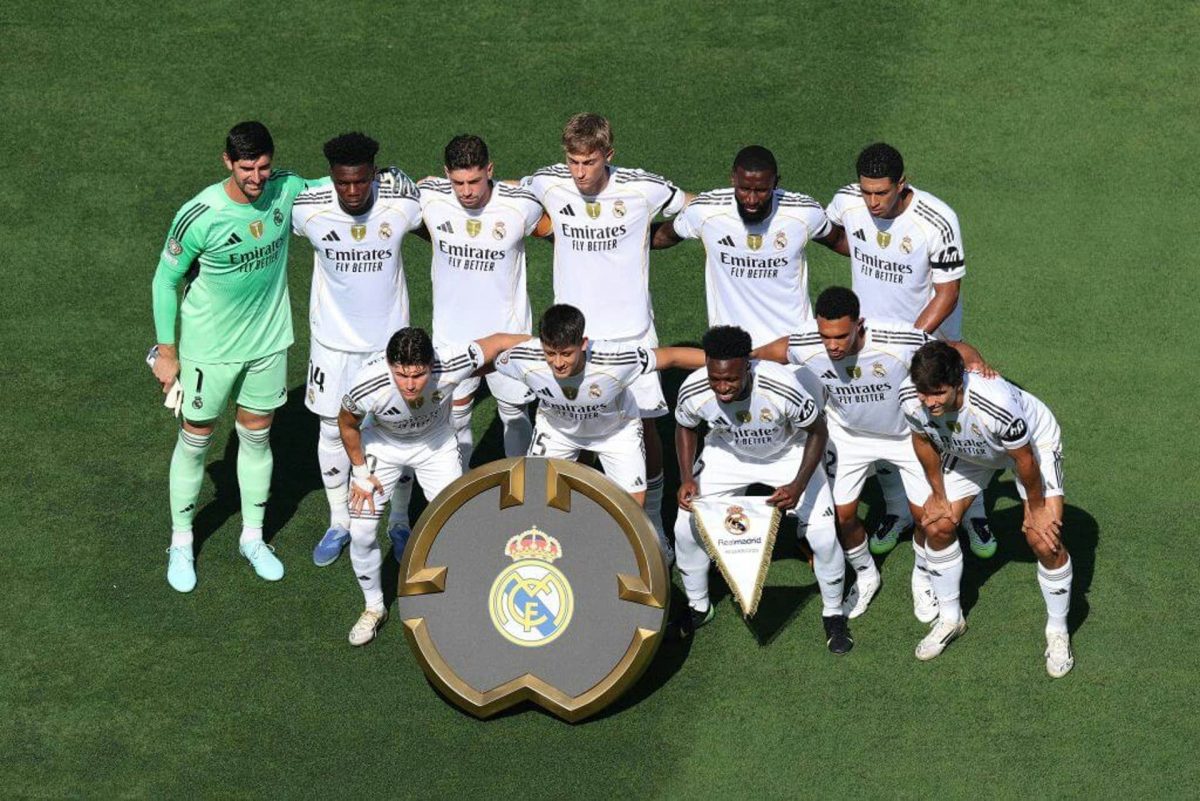Real Madrid La Liga disputepeople' 'soccer' 'uniform' 'team' 'grass' 'crest.