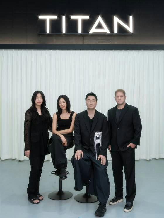 Lia Kim joins TITAN CONTENTfour' '' 'itan' 'business' 'formalwear' 'pose.