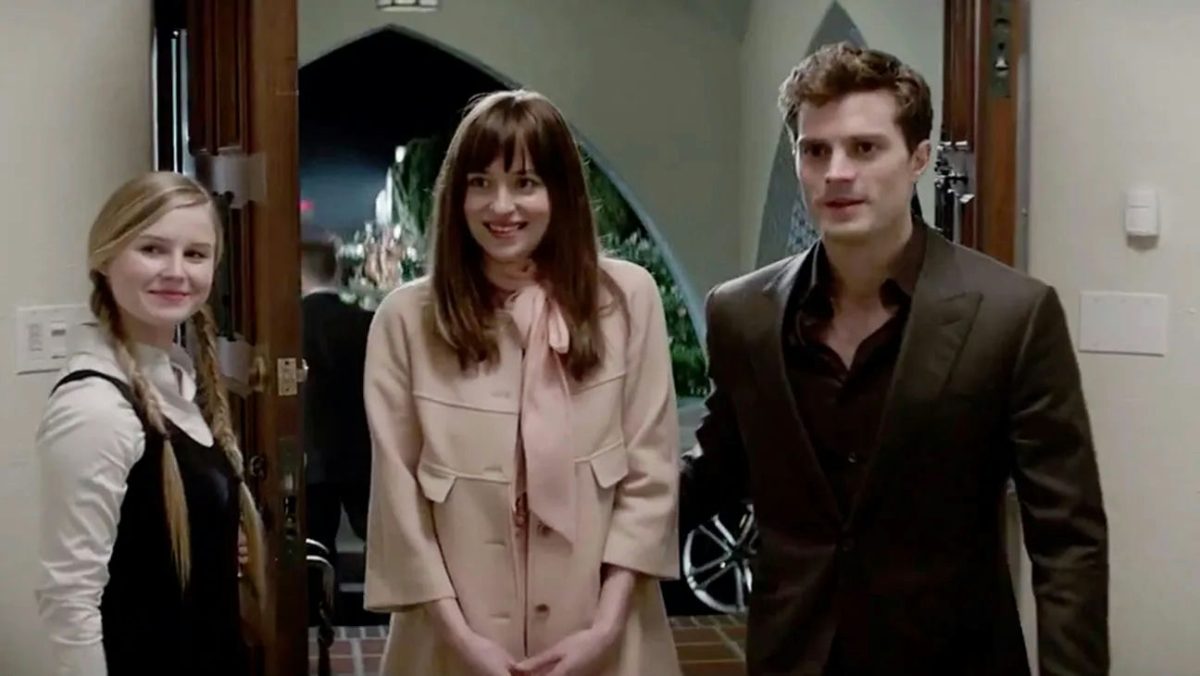 Fifty Shades of Grey review and cast updatethree' 'smiling' 'formal' 'wear' 'doorway' 'event.