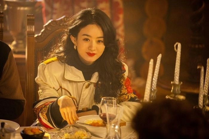 Chinese actresses who carry a dramawoman' 'dining' 'retro' 'candles' 'table.