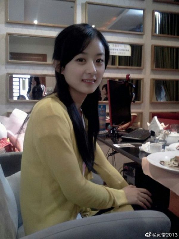 Zhao Liying Dior ambassadorperson' 'indoors' 'smiling' 'black' 'hair' 'yellow' 'top.