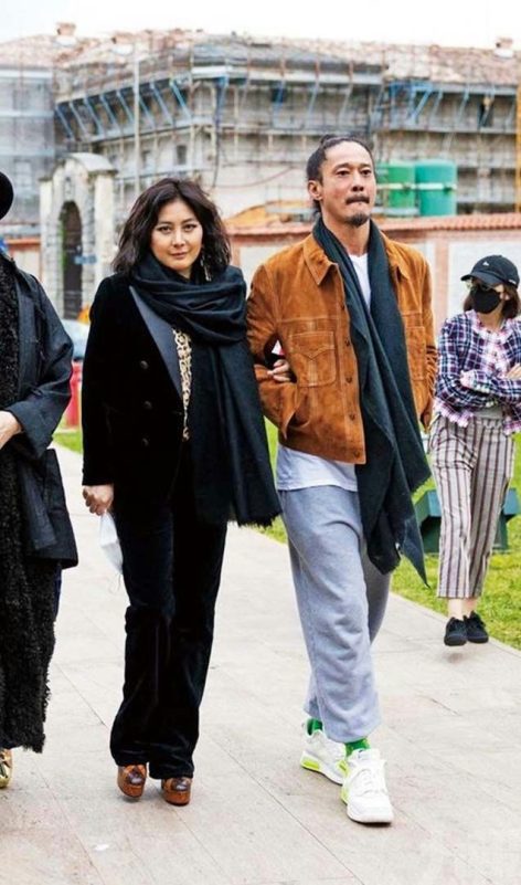 Conroy Chan Macau tycoon son-in-lawthree' 'walking' 'outfit' 'scarf' 'building.