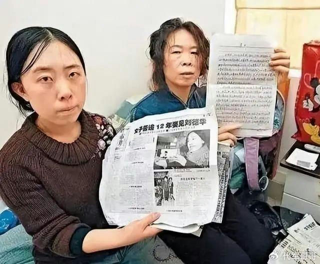 women' 'holding' 'newspaper' 'written' 'document' 'indoor.