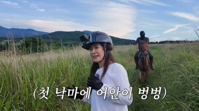 Kwon Yuri horseback riding fallpeople' 'grass' 'horse' 'helmet' 'camera.