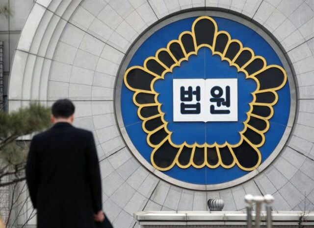 K-pop idol sued over one-night standpeople' 'man' 'court' 'logo' 'suit.