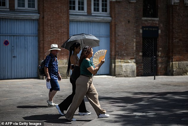 Europe heatwave wildfires 2025' '' 'heat' 'walking' 'sunshade' 'fan.