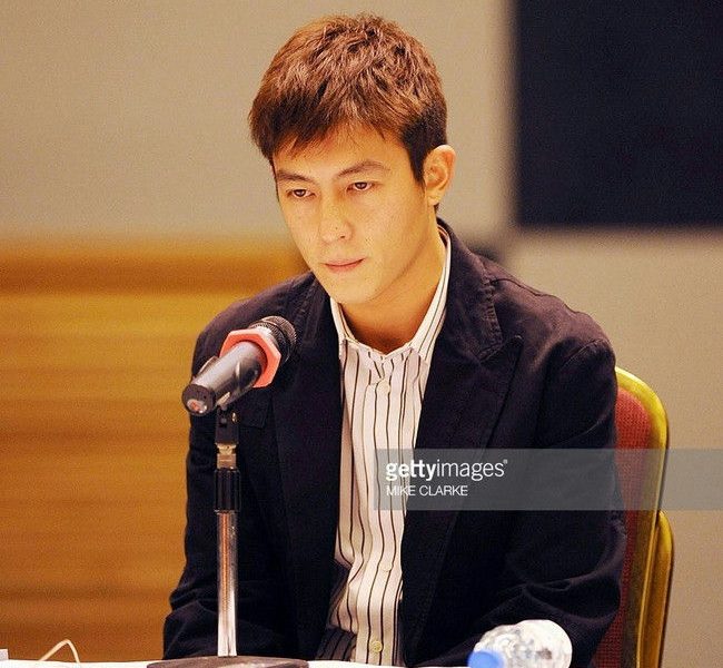 Edison Chen Nike lawsuitperson' '' 'dison' '' 'hen' 'microphone' 'table' 'press' 'conference.