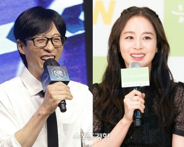 Kim Tae-hee Yoo Jae-suk reunionpeople' 'two' 'microphones' 'smiling' 'formalwear.