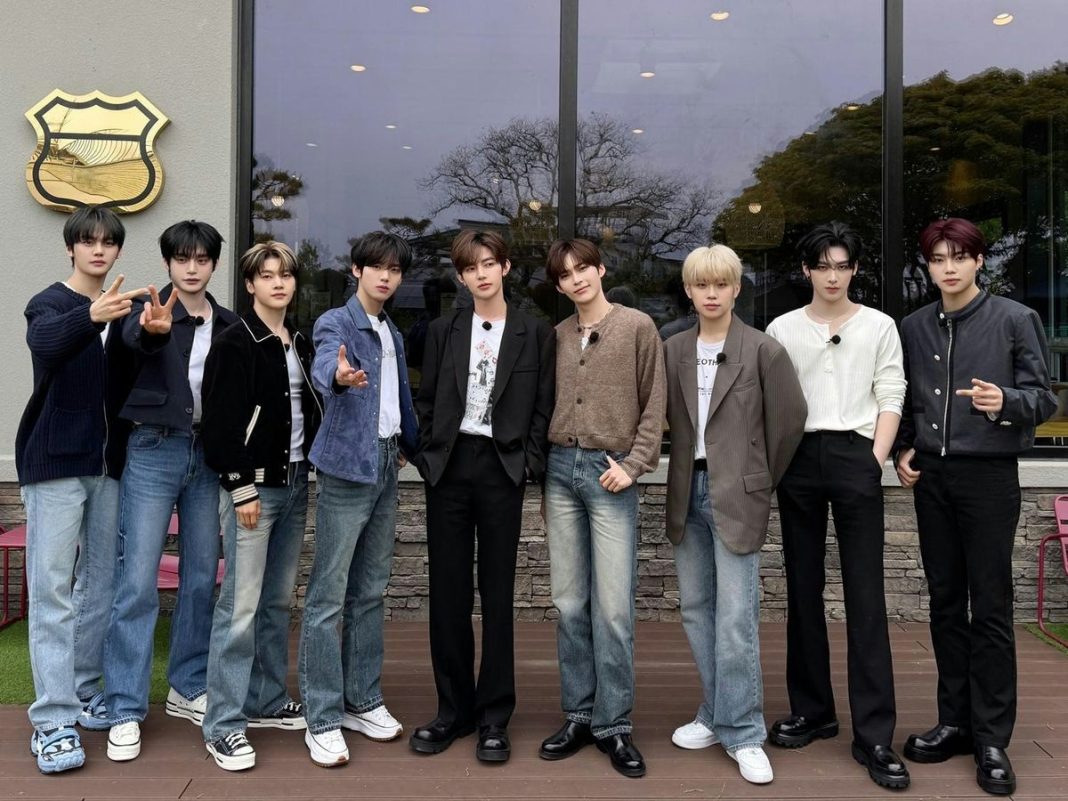 K-pop project group contract renewalpeople' 'group' 'posing' 'outdoors' 'casual.