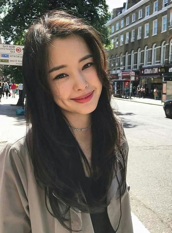 Honey Lee 2NE1 Miss Korea woman' 'smiling' 'necklace' 'street' 'day.