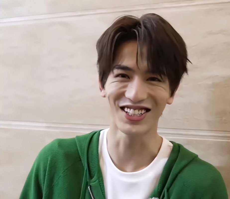 Chinese male actors lose visuals when smilingpeople' 'smile' 'hoodie' 'indoors.