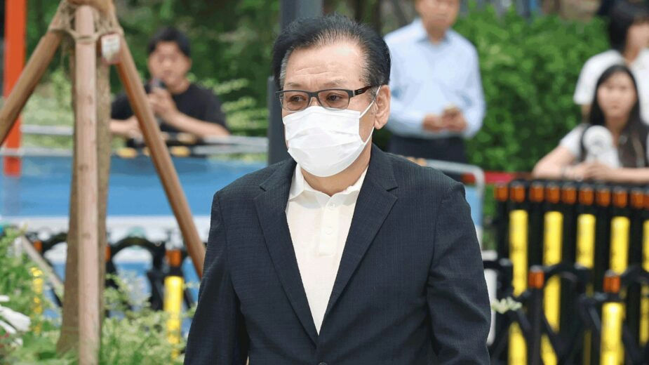 celebrity sexual assault case shaman SBS report person' 'mask' 'suit' 'glasses' 'outdoors.