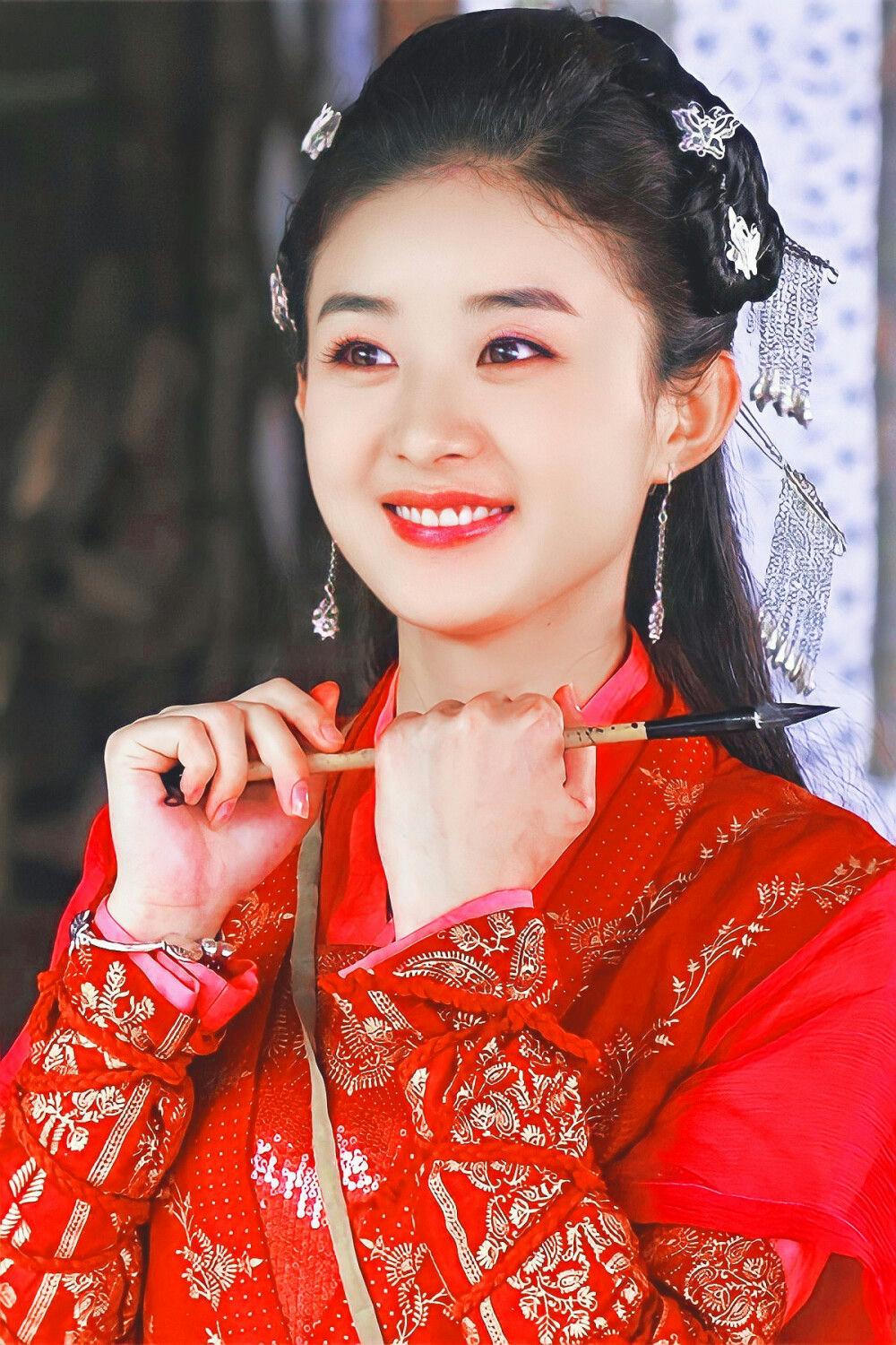 Chinese actresses beautiful smilesperson' 'smiling' 'red' 'clothing' 'hair' 'ornaments' 'calligraphy' 'brush.