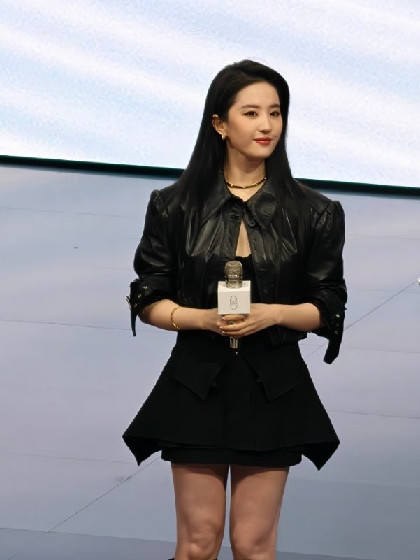 Liu Yifei public appearancewoman' 'blackoutfit' 'microphone' 'portrait.