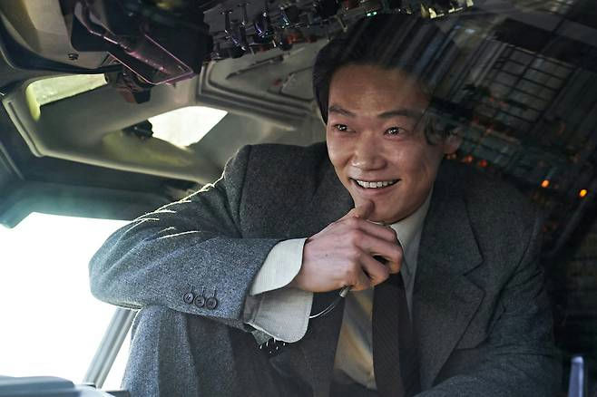 Netflix Good News Korean Japanese castperson' 'cockpit' 'smiling' 'suit' 'tie.