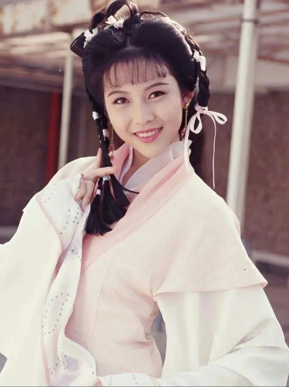 Ada Choi sold to tycoon forced relationshipperson' 'smiling' 'braids' 'traditional' 'clothing' 'pink.