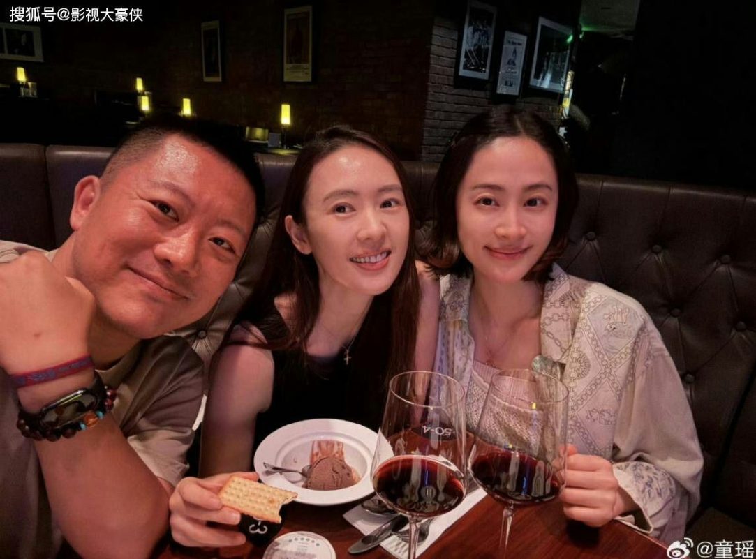Tong Yao divorce rumors mystery manthree' 'people' 'smiles' 'wine' 'glasses' 'dinner' 'indoor.