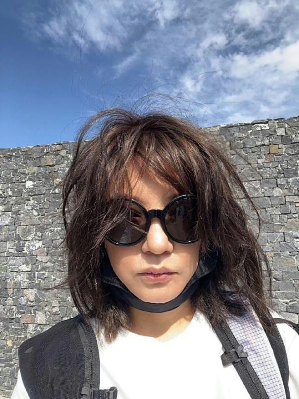 Zhao Wei financial downfallperson' 'sunglasses' 'backpack' 'outdoors' 'mask.