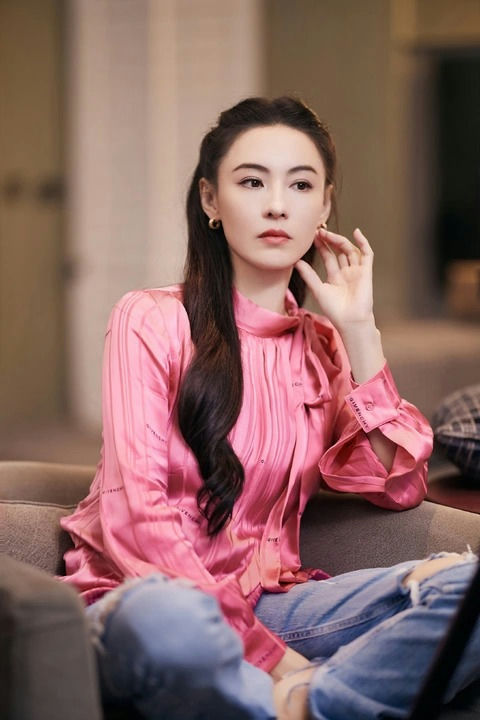 Edison Chen scandal victimswoman' 'pink' 'satin' 'jeans' 'couch.