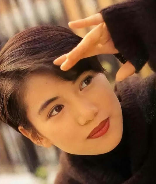 Anita Yuen Julian Cheungwoman' 'portrait' 'hand' 'red' 'lipstick' 'sweater.