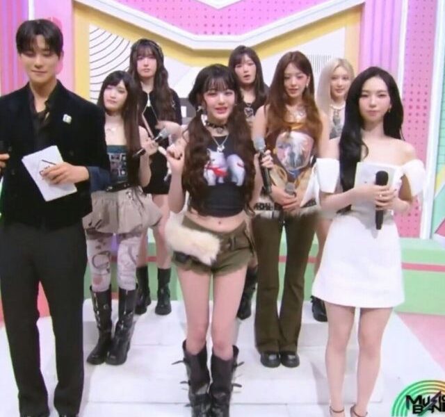 Karina Wonyoung share stagepeople' 'group' 'stage' 'microphones' 'posing.