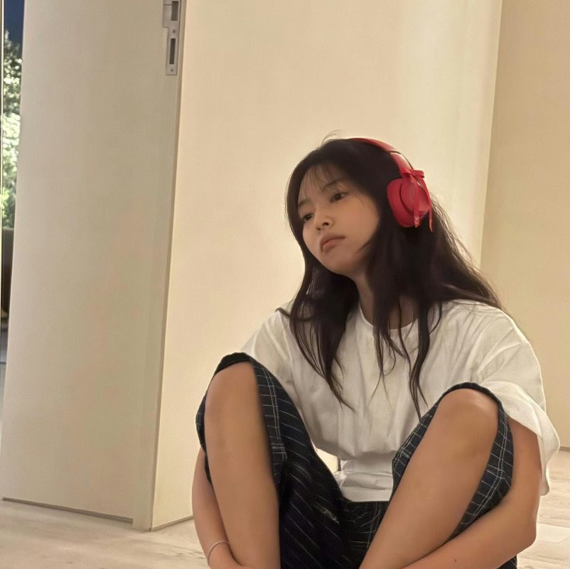 Jennie BLACKPINK no makeupperson' 'redheadphones' 'sitting' 'indoors' 'casual.