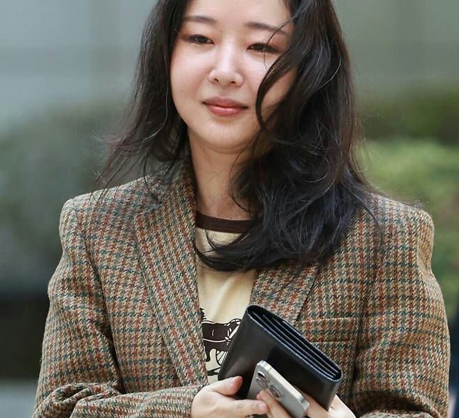 Min Hee Jin HYBE lawsuit Japanese investorsperson' 'portrait' 'blazer' 'wallet' 'phone.