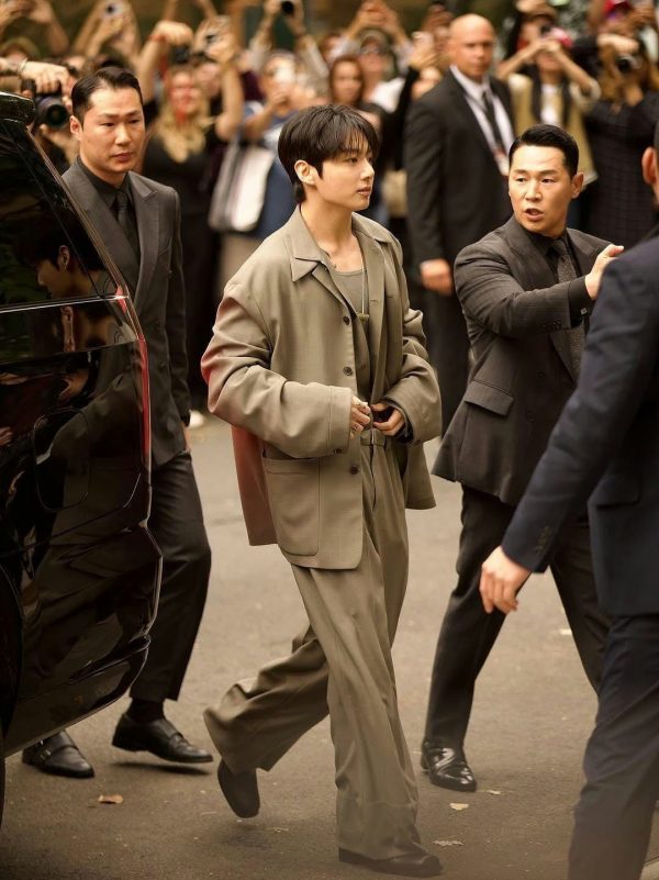 Jungkook Fashion Week debutpeople' 'walking' 'suit' 'crowd' 'security.