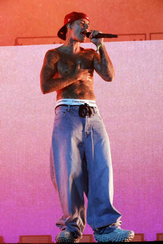 BIGBANG Coachella 2026 lineupperson' 'singer' 'tattoos' 'microphone' 'jeans.